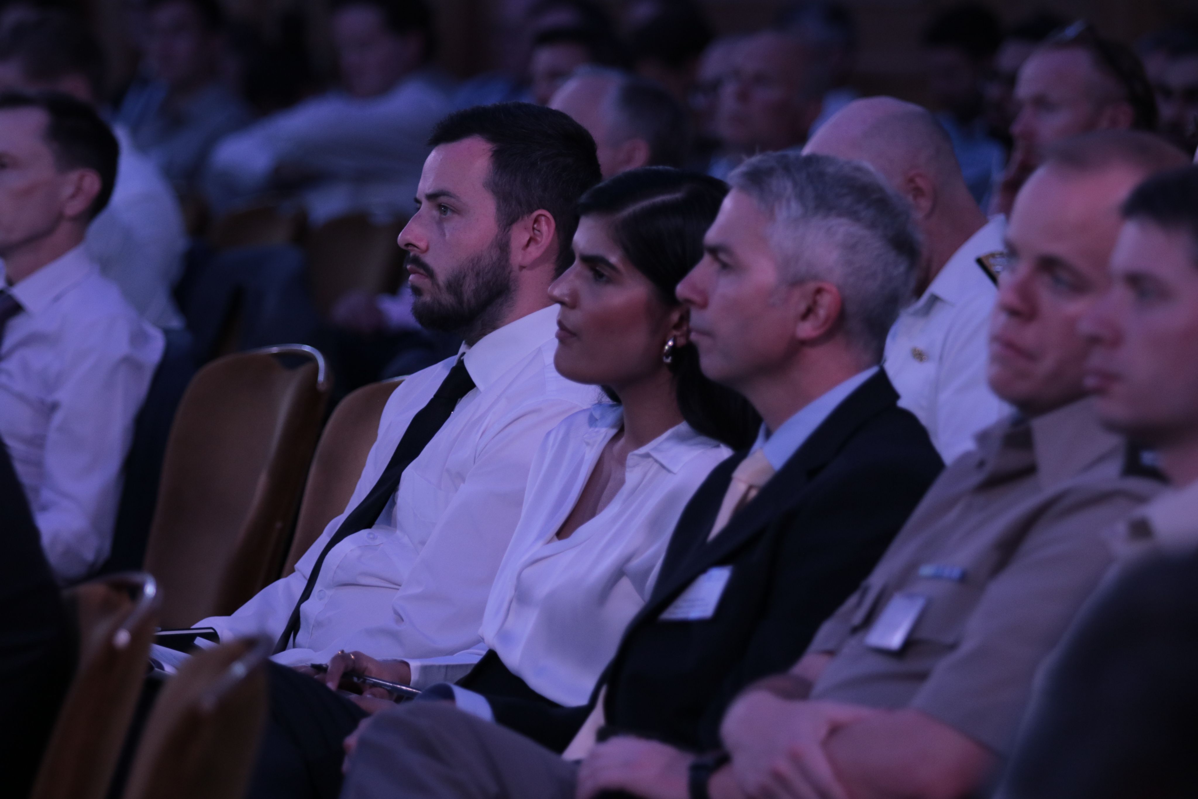 An audience sat listening to speakers at a RUSI conference